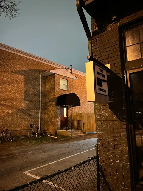 Alley secrets under the night sky.
